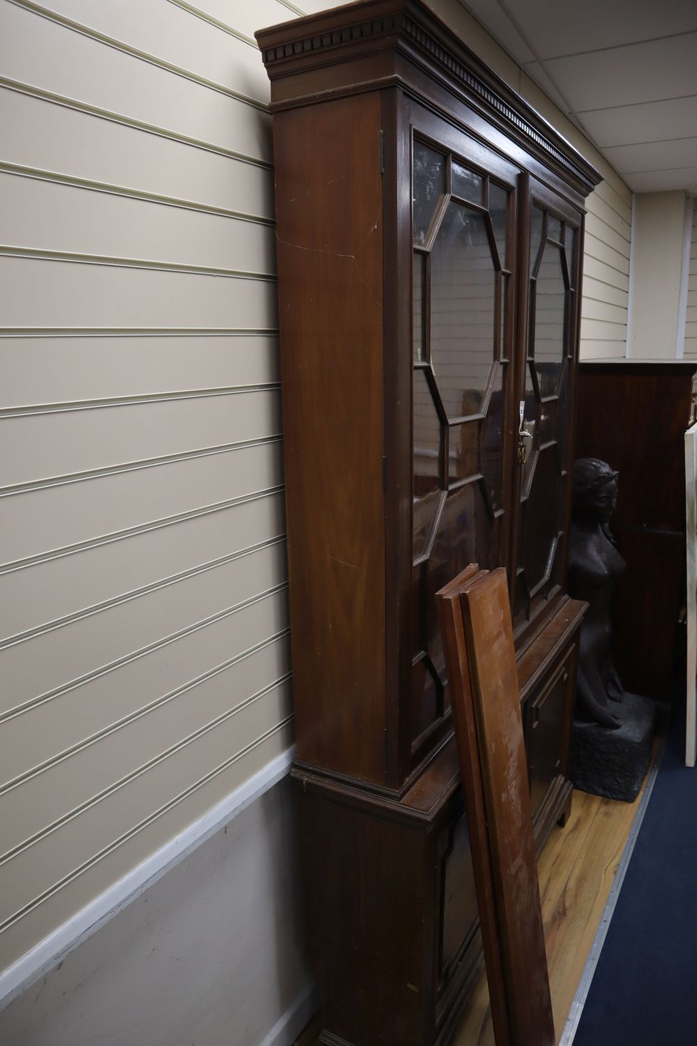 An Edwardian walnut bookcase, width 142cm height 225cm